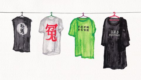 Watercolour. Four t-shirts on hangers along a clothes line against a white background. The two outermost are black with text in Chinese or French. The second from the left is white with a red character, and the next is neon green with black writing.